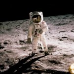 astronaut standing on gray sand